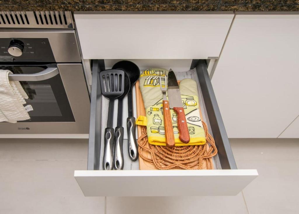 a drawer filled with utensils in a kitchen at Stylish 2BR Apt in Top Location in Asunción