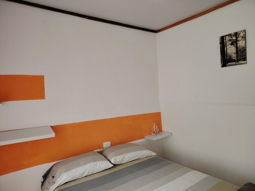 Postel nebo postele na pokoji v ubytování Casa Cristy