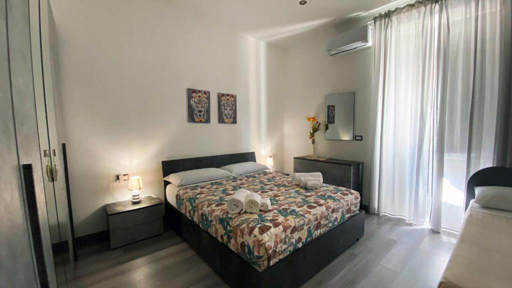 Postel nebo postele na pokoji v ubytování Sicily Casa Vacanze