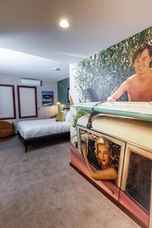 Postel nebo postele na pokoji v ubytování Daddy O Hotel