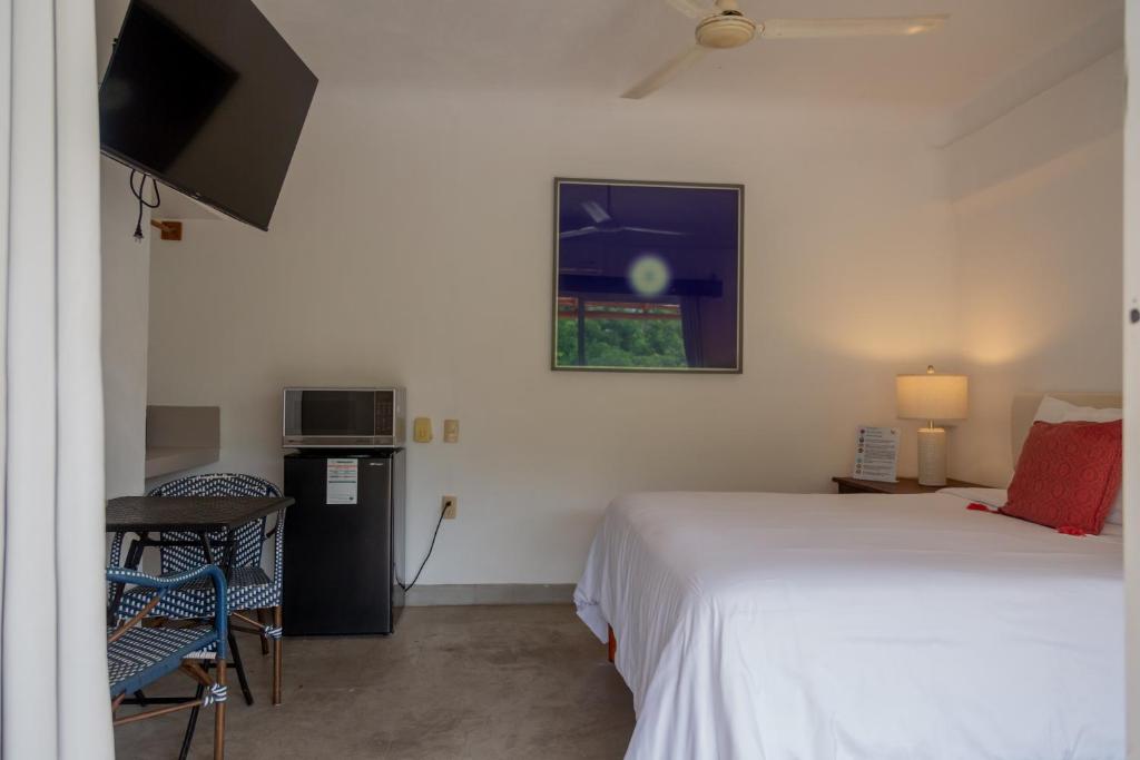 Postel nebo postele na pokoji v ubytování Hotel Amaca Puerto Vallarta - Adults Only