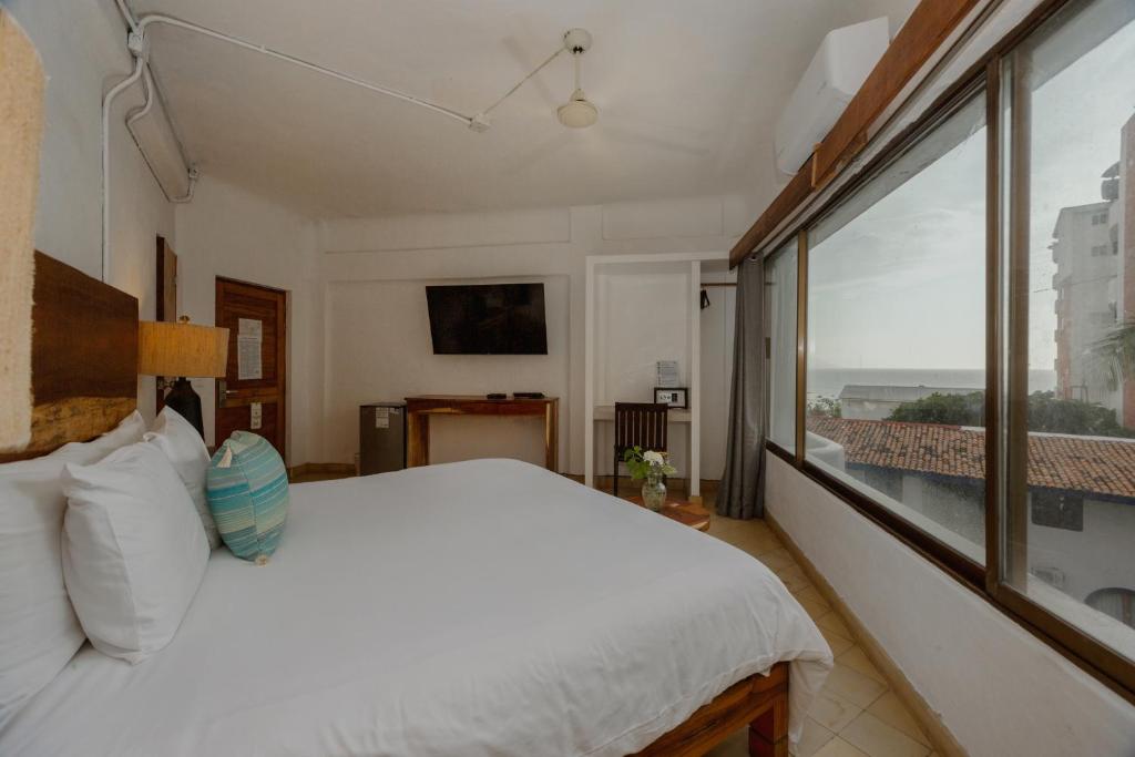 Postel nebo postele na pokoji v ubytování Hotel Amaca Puerto Vallarta - Adults Only