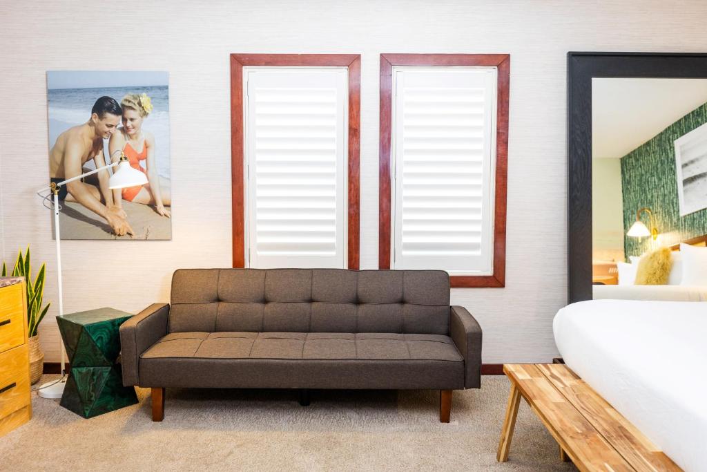 Postel nebo postele na pokoji v ubytování Daddy O Hotel