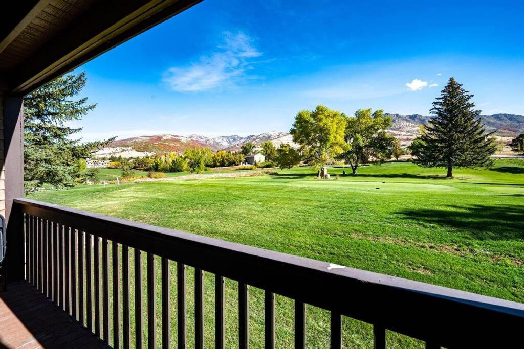 a view of a golf course from the porch of a house at Welcoming Wolf Getaway in Eden