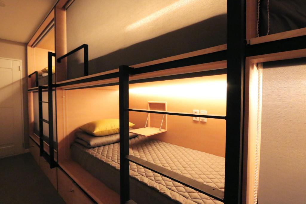 Postel nebo postele na pokoji v ubytování Blueboat Hostel Gyeongju