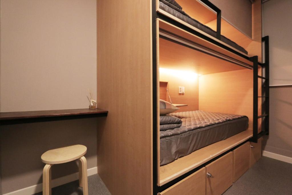 Postel nebo postele na pokoji v ubytování Blueboat Hostel Gyeongju