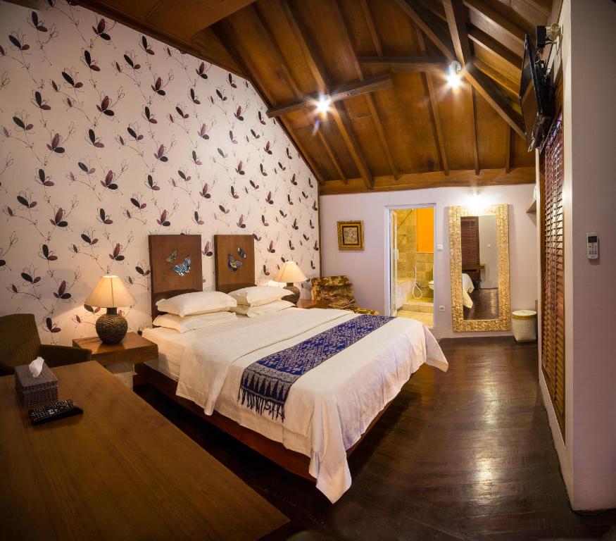 Łóżko lub łóżka w pokoju w obiekcie Tegal Panggung Guest House