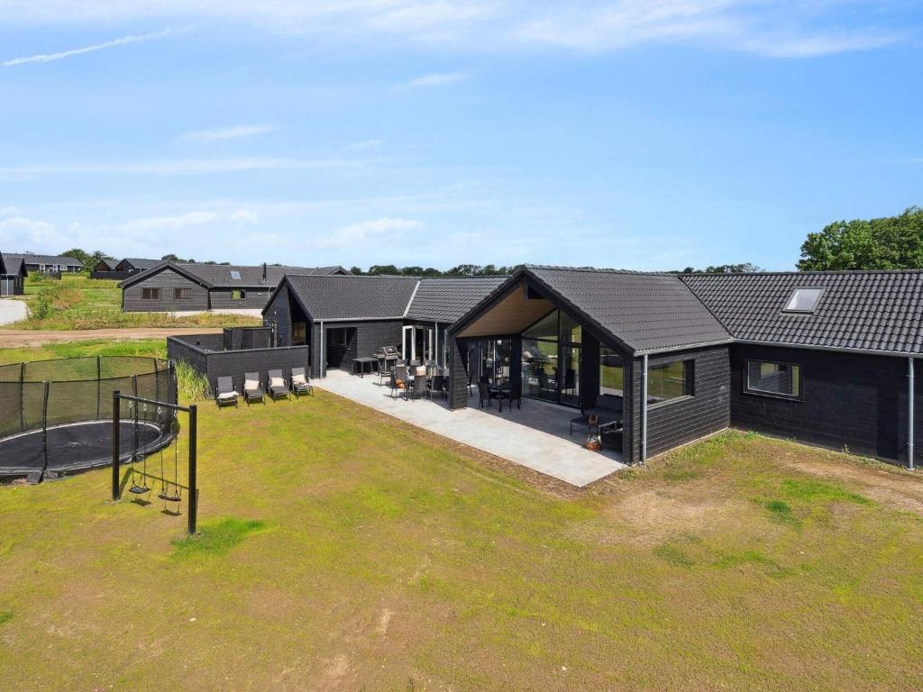 een luchtzicht op een huis met een speeltuin bij Spacious Retreat near Beach - By Traum Ferienwohnungen in Sarup