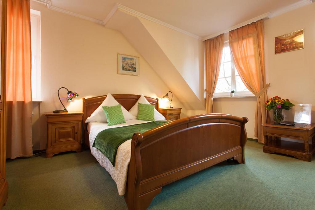 Säng eller sängar i ett rum på Hotel Athos
