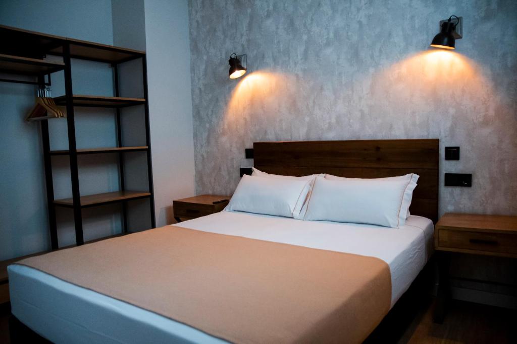 Postel nebo postele na pokoji v ubytování Aparthotel Luz de Gades - Suites Spa Gym - Adults Only