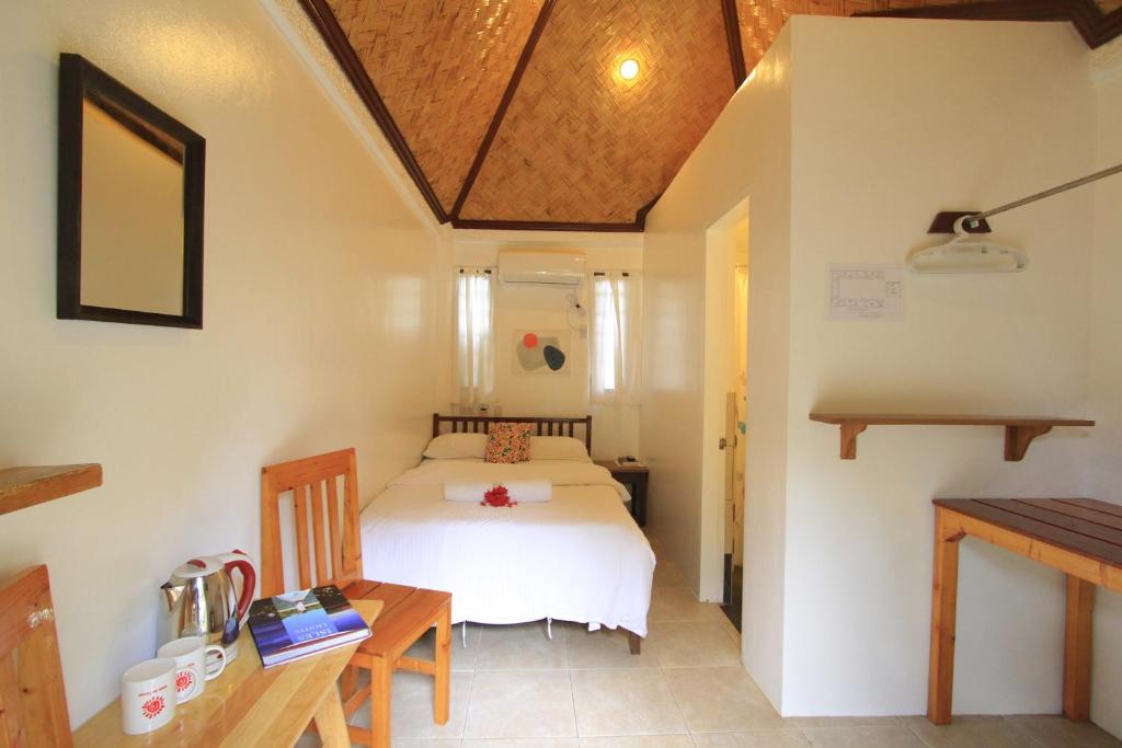 Postel nebo postele na pokoji v ubytování Sunz en Coron Resort