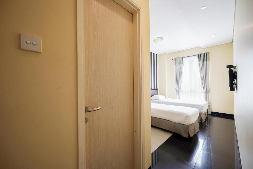 Letto o letti in una camera di Multi 88 Syariah