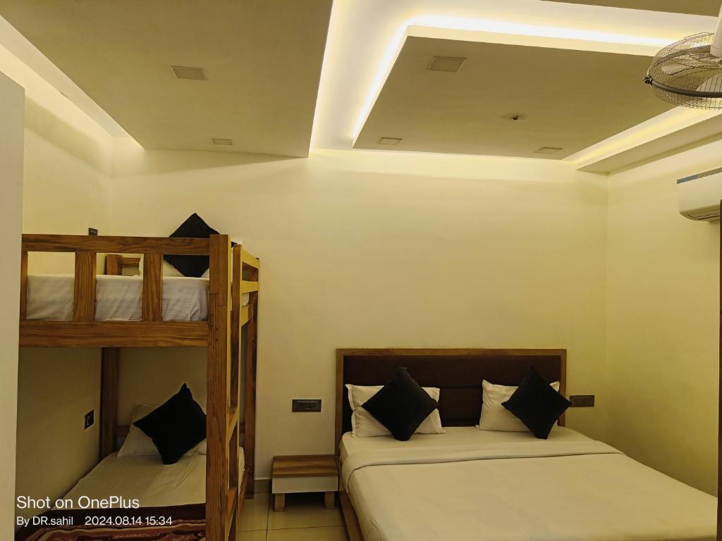 Postel nebo postele na pokoji v ubytování Good Vibes Hotel