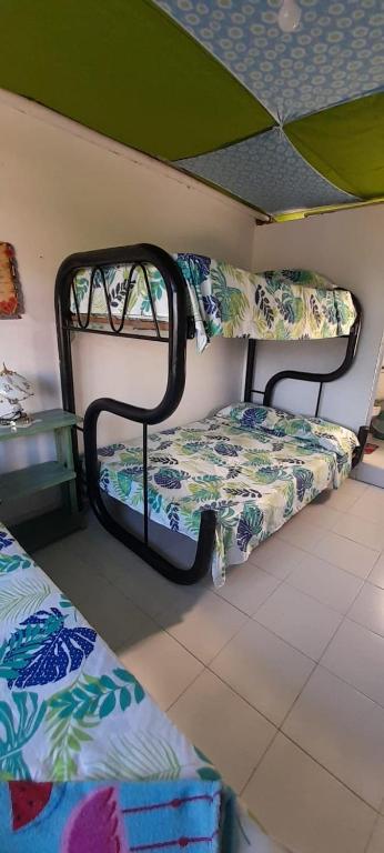 Postel nebo postele na pokoji v ubytování MANOA "Lugar de descanso" HABITACION CON VISTA A LA CIUDAD, FRESCO Y VENTILADO