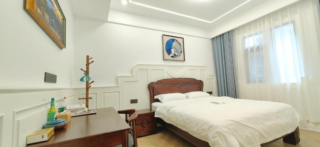 Postel nebo postele na pokoji v ubytování Dream in Fenghuang