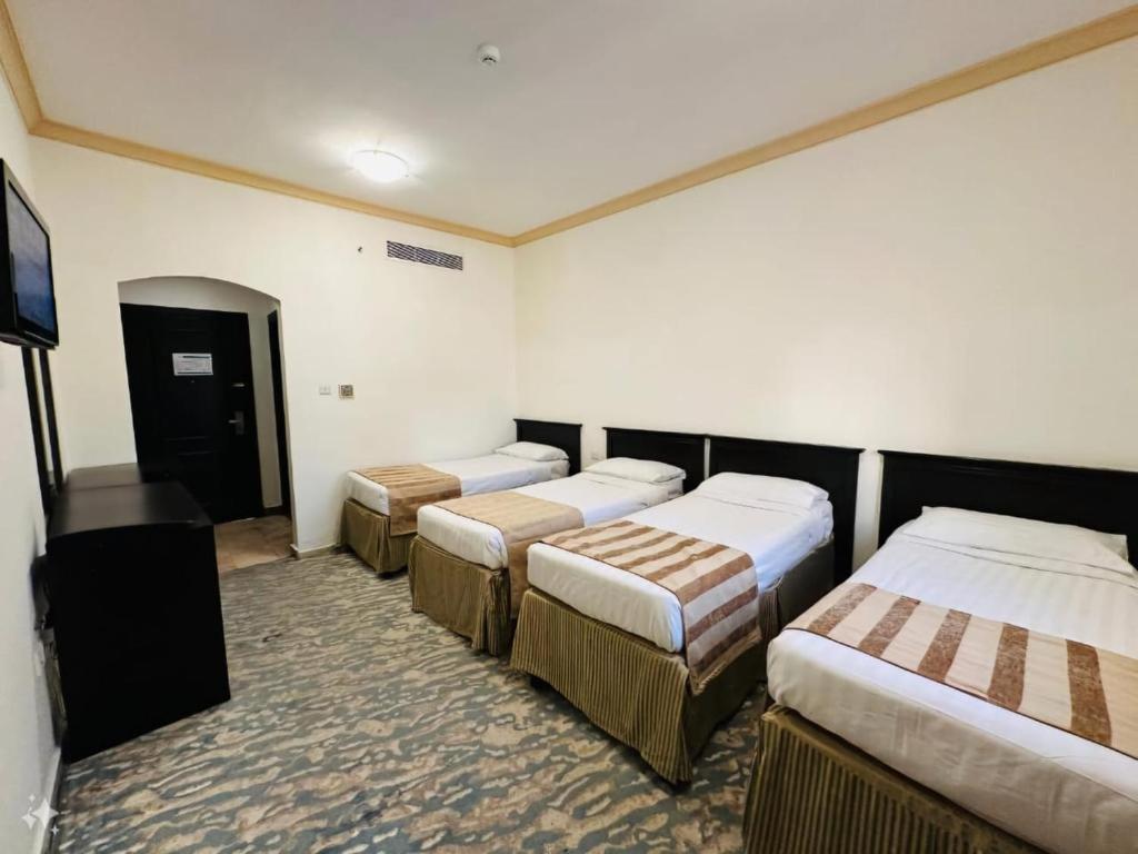 Rushud Al Majd Hotel - Habitación Cuádruple Deluxe