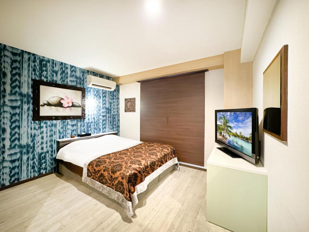 TV a/nebo společenská místnost v ubytování Hotel BaliBali Matsudo