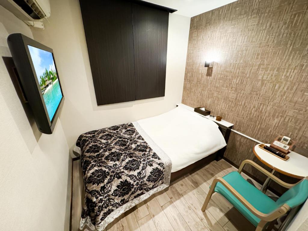 Postel nebo postele na pokoji v ubytování Hotel BaliBali Matsudo