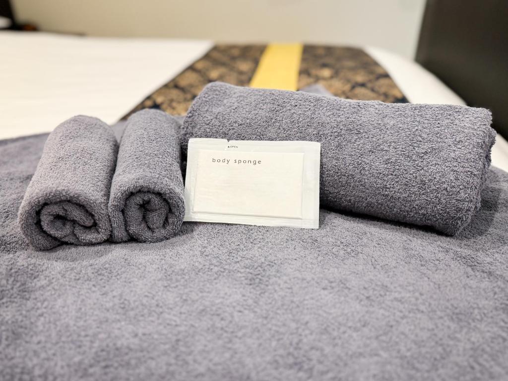 Postel nebo postele na pokoji v ubytování Hotel BaliBali Matsudo