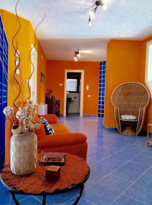 a living room with a couch and a table at La Taverna dei Colori in Laurino