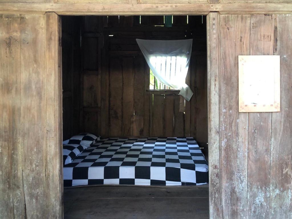 Postel nebo postele na pokoji v ubytování Omah Guyub