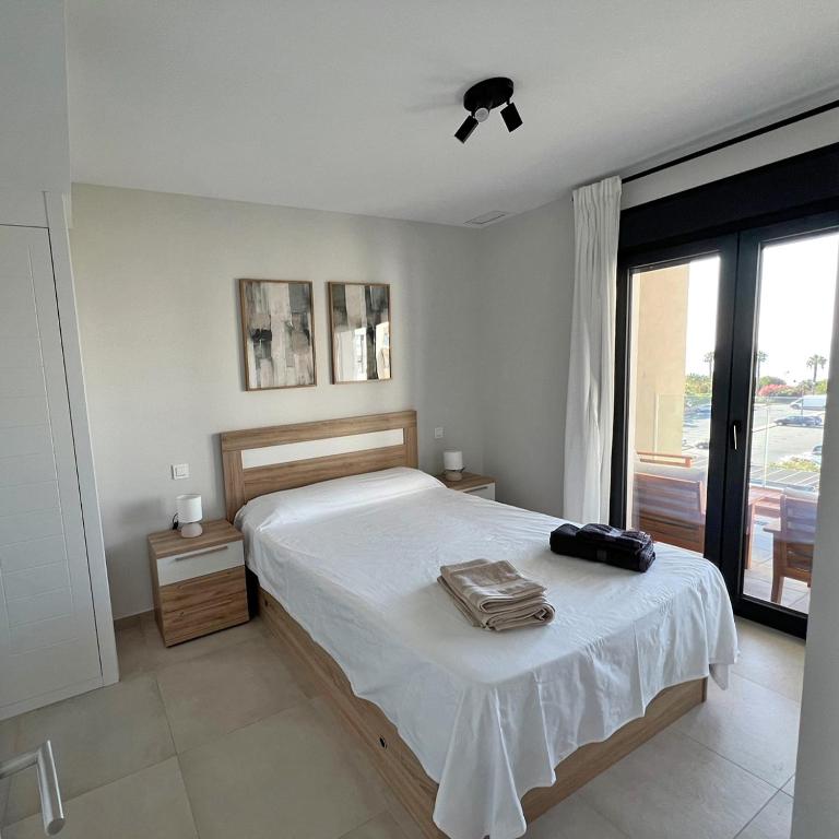 Posteľ alebo postele v izbe v ubytovaní The Paradise Apartment