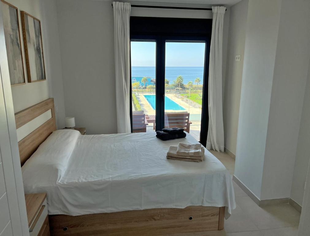 Posteľ alebo postele v izbe v ubytovaní The Paradise Apartment