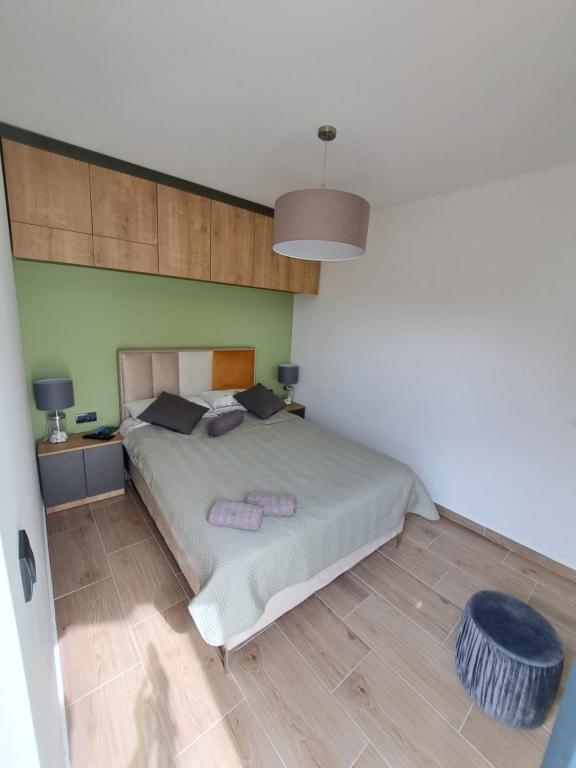 Uma cama ou camas num quarto em Apartlux Helena1