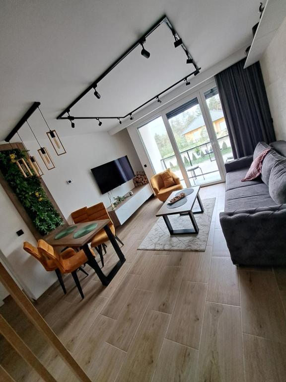 Uma televisão e/ou sistema de entretenimento em Apartlux Helena1
