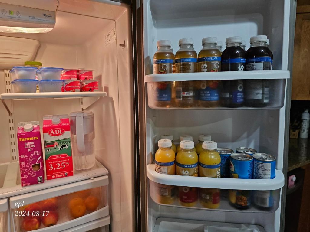 an open refrigerator filled with lots of drinks at Small Town Bound Inn in Montague