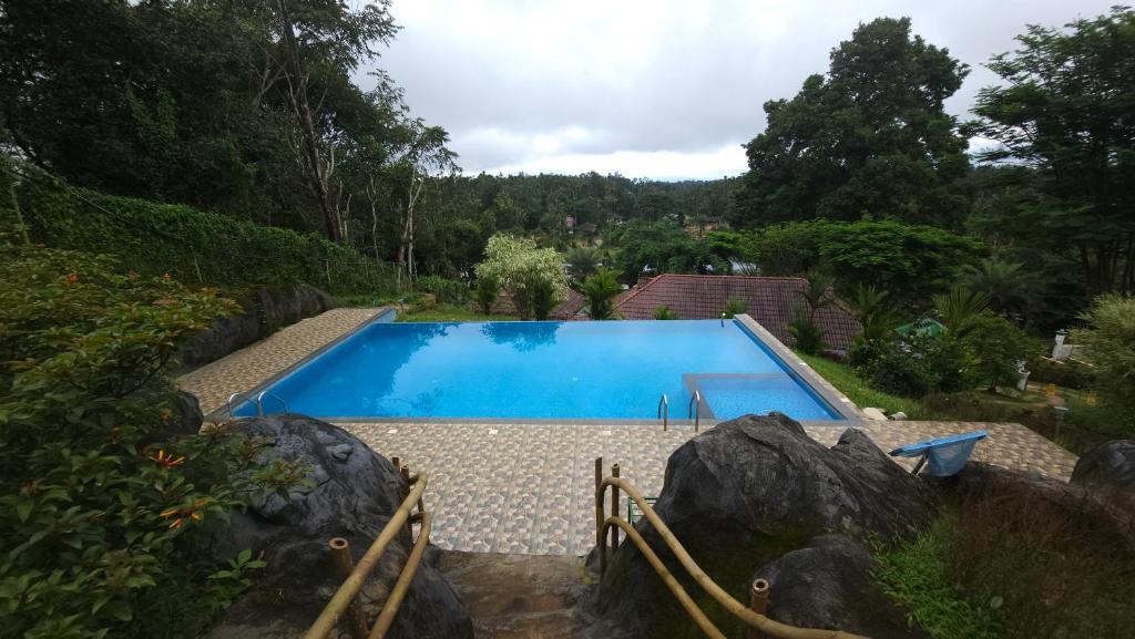 Bazén v ubytování Green Ample Resorts nebo v jeho okolí