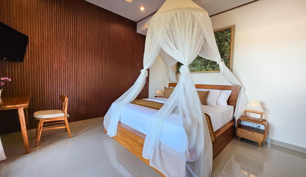 Postel nebo postele na pokoji v ubytování Weda Villas