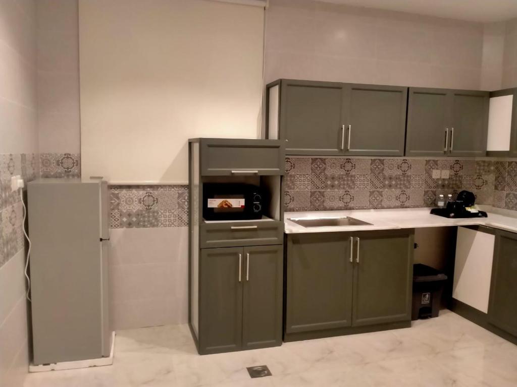 Köök või kööginurk majutusasutuses شقق هوليداي بلس مشرفه - Holiday Plus Mishrifah Apartments