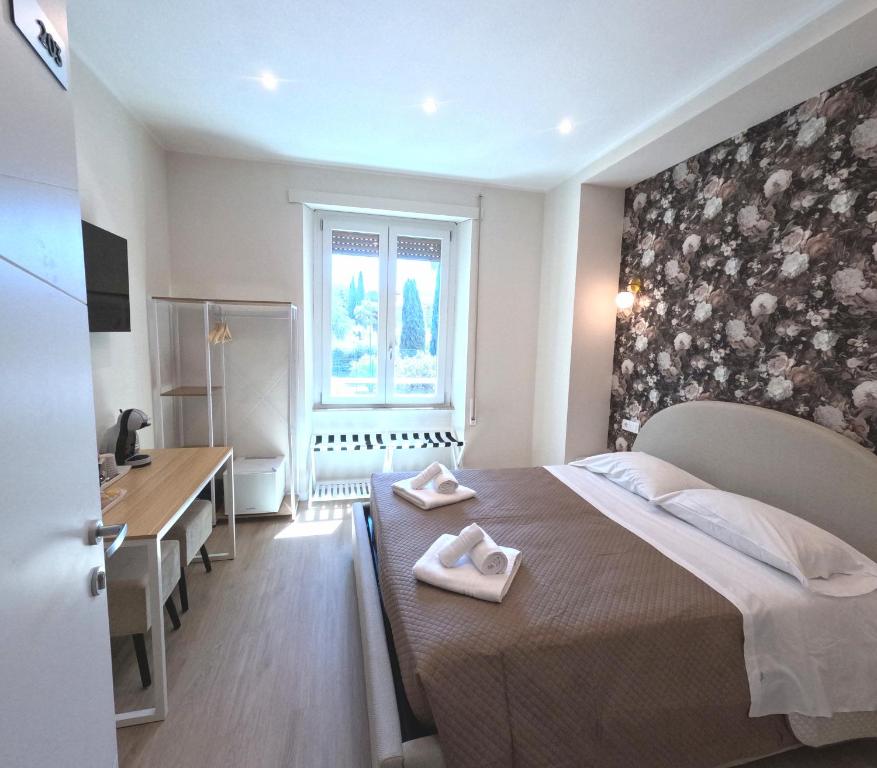 Postel nebo postele na pokoji v ubytování B&B Aurelia Garden Rooms