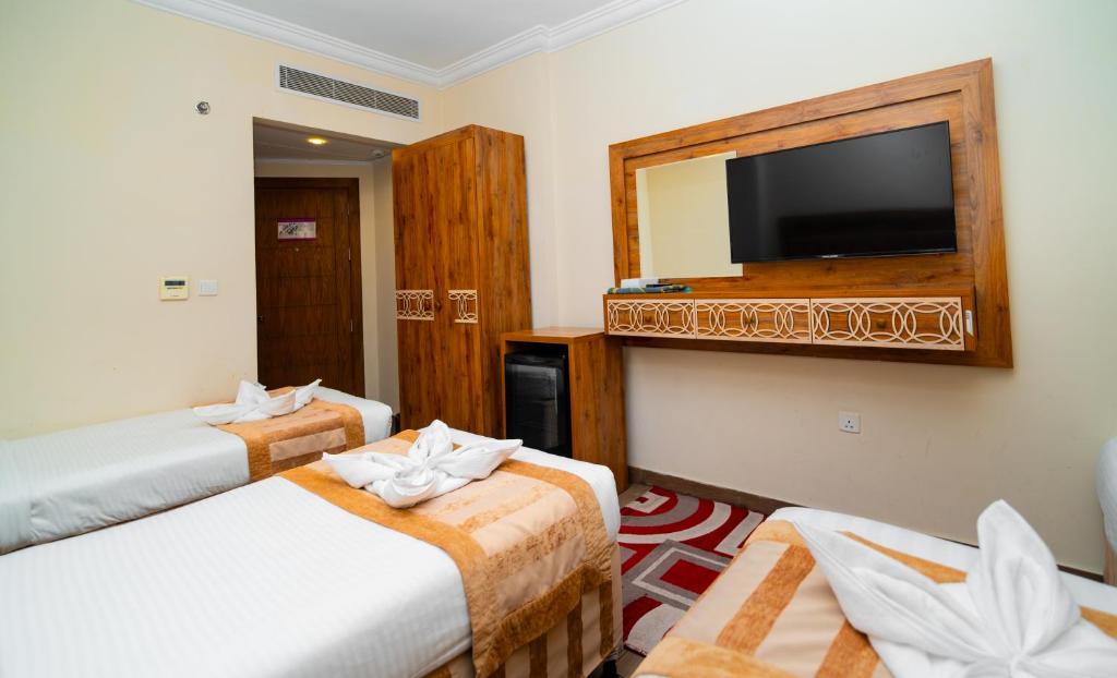 Postel nebo postele na pokoji v ubytování فندق فيوليت 2