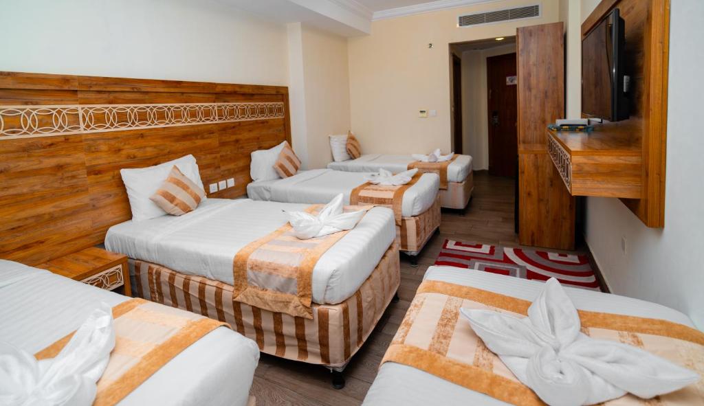 Postel nebo postele na pokoji v ubytování فندق فيوليت 2
