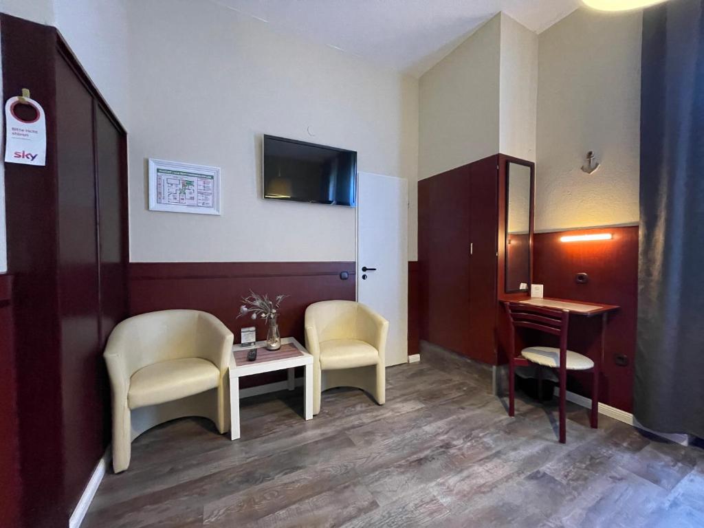 TV a/nebo společenská místnost v ubytování Hotel Hanseatic