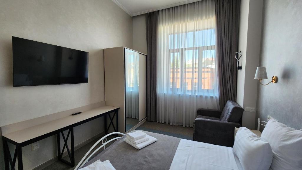 Postel nebo postele na pokoji v ubytování Prime Hotel