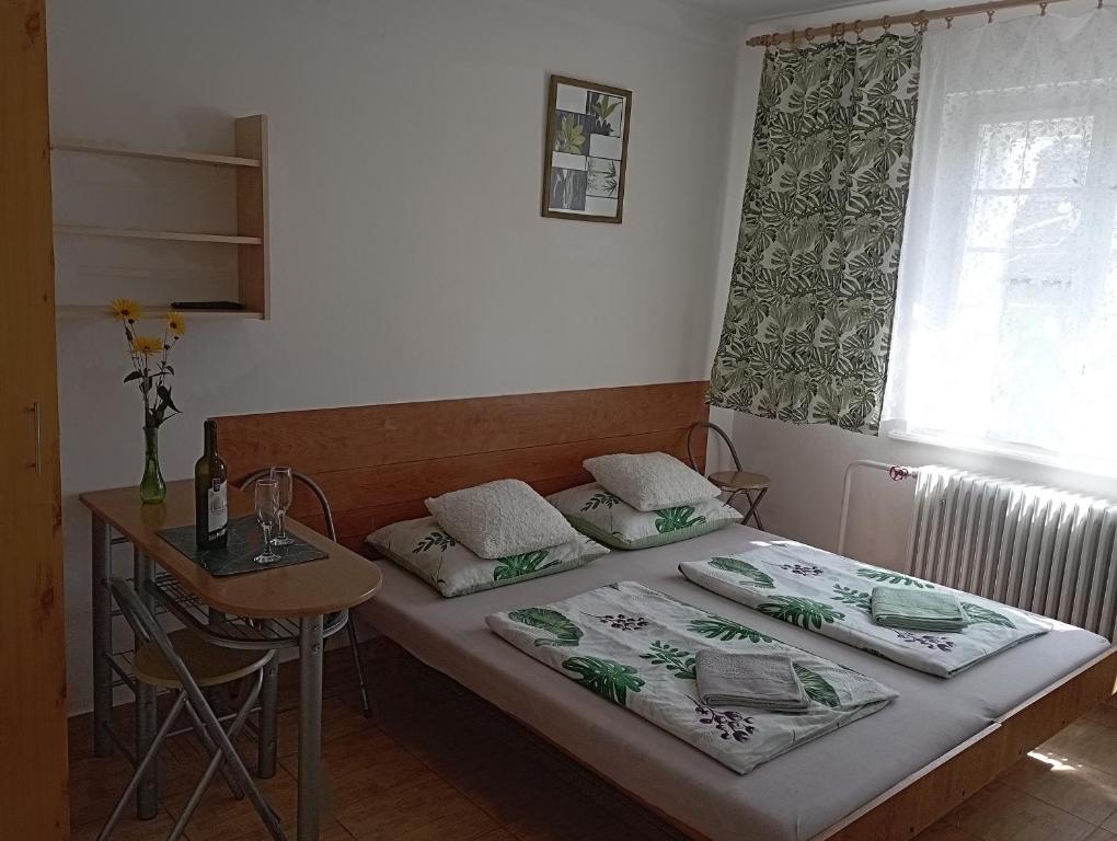 Postel nebo postele na pokoji v ubytování Afrodita