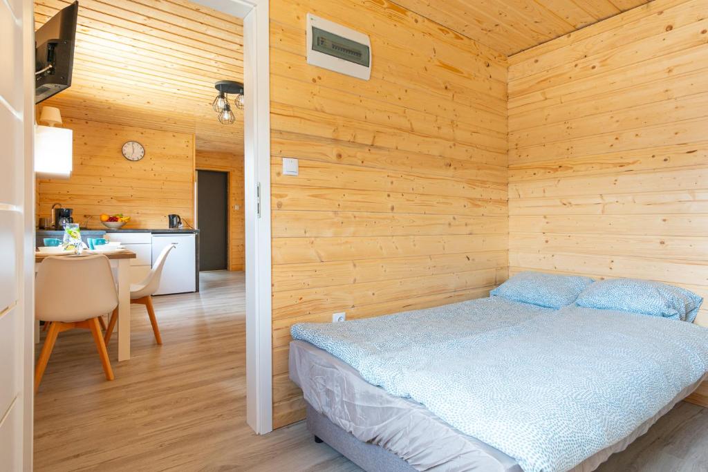 Postel nebo postele na pokoji v ubytování OSADA JANTAR 2