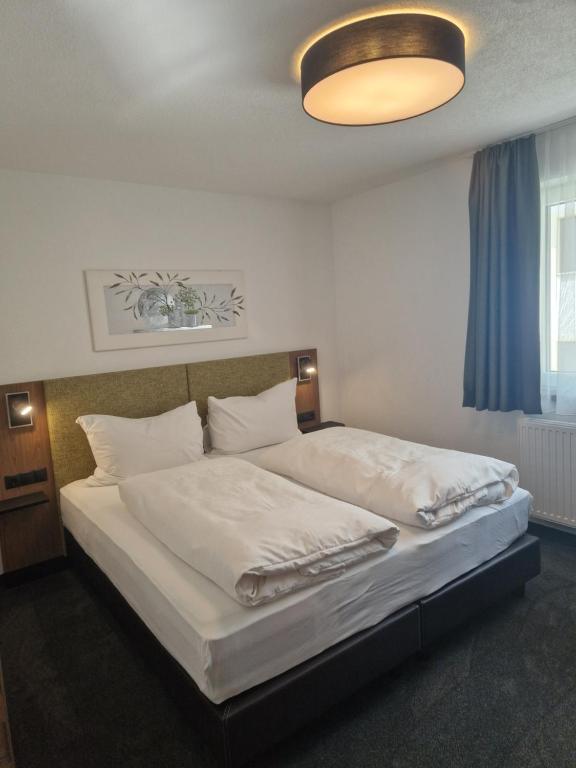 Postel nebo postele na pokoji v ubytování Haus Talblick