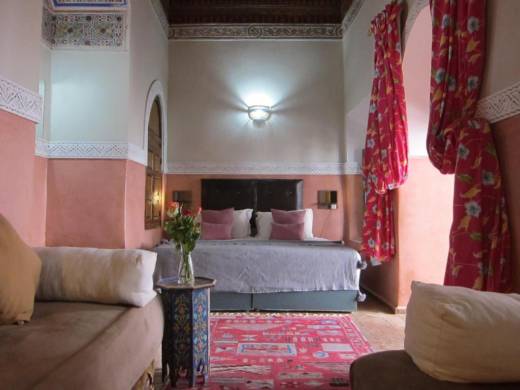 Postel nebo postele na pokoji v ubytování Riad Maizie