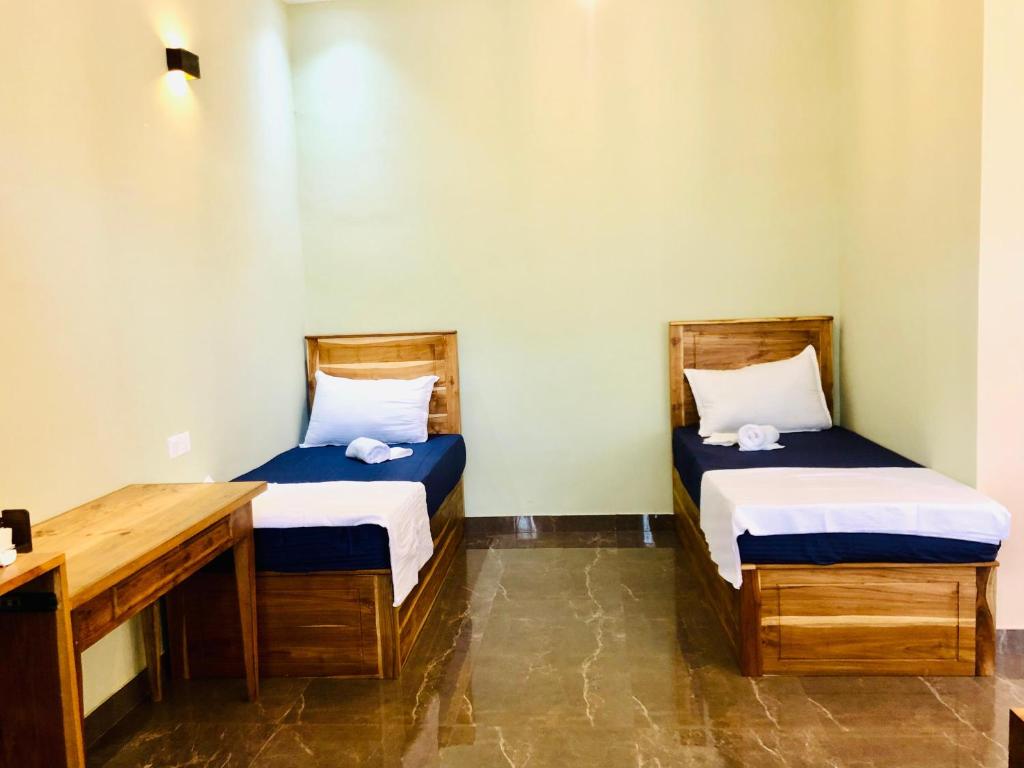 Postel nebo postele na pokoji v ubytování Sound Sleep Resort