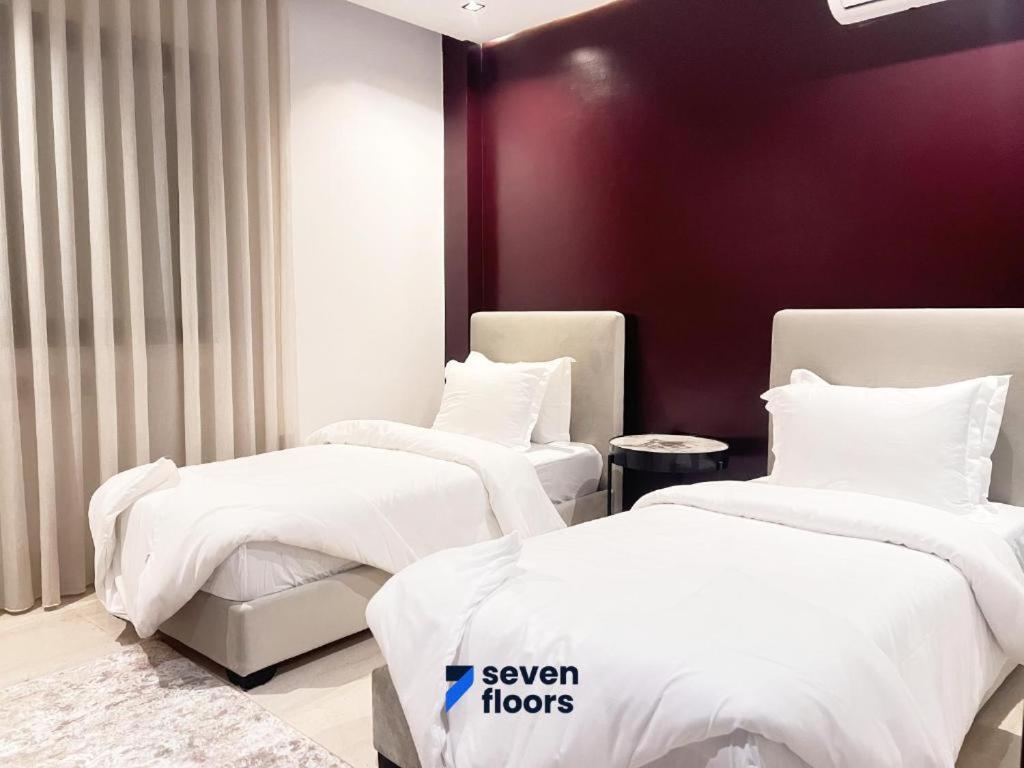 Postel nebo postele na pokoji v ubytování Seven Floors