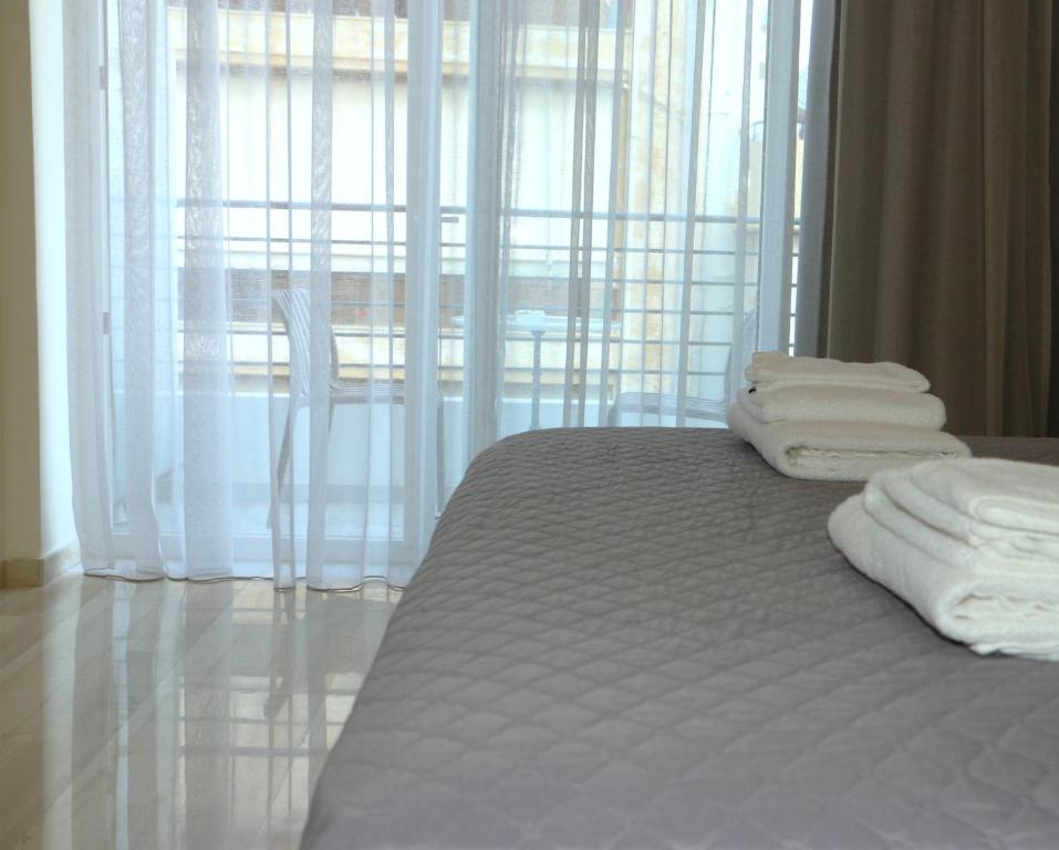 Postel nebo postele na pokoji v ubytování Piraeus Relax