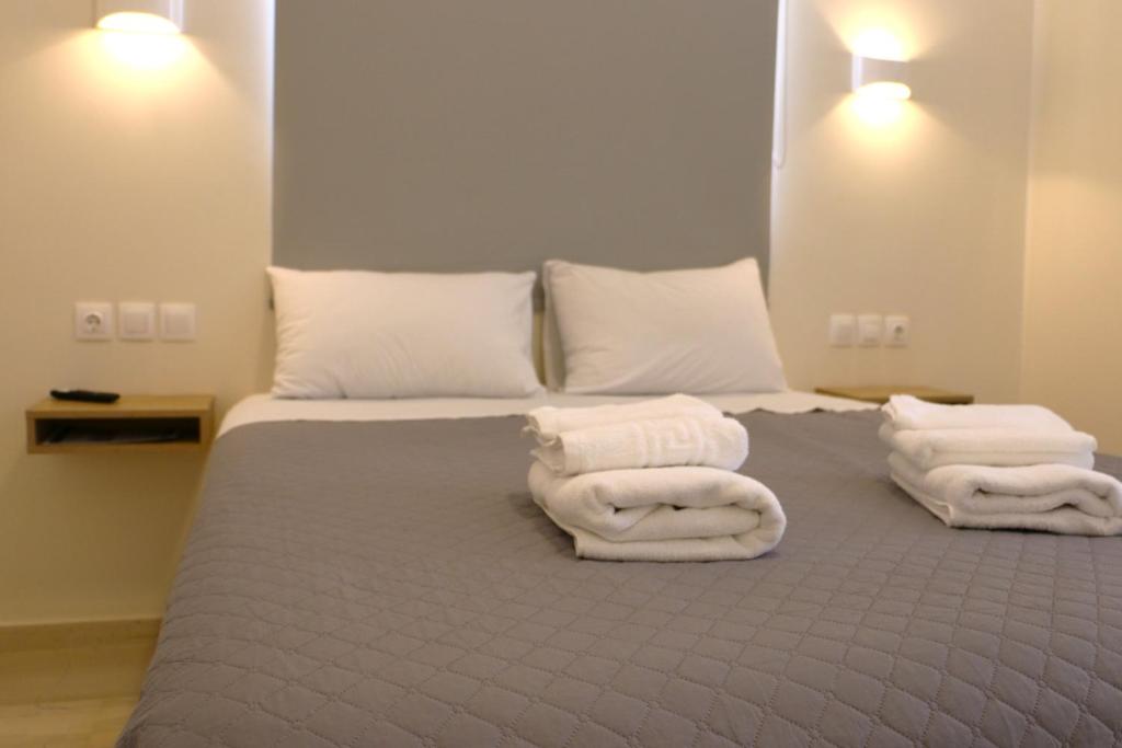 Postel nebo postele na pokoji v ubytování Piraeus Relax