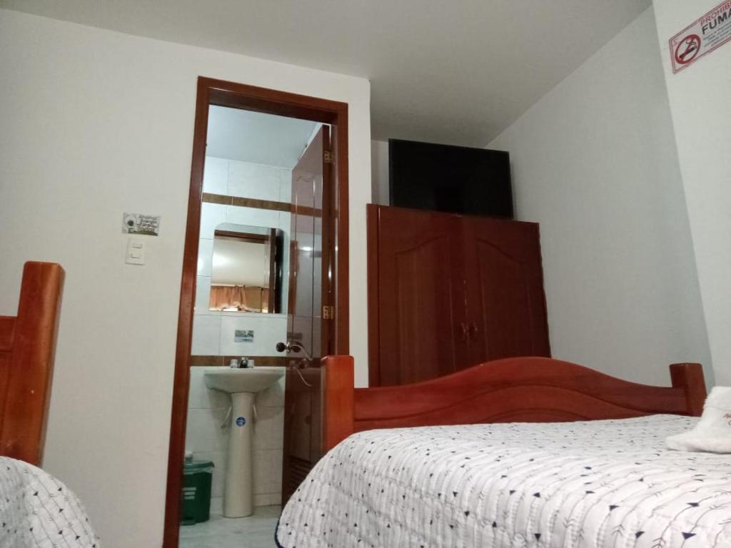 Postel nebo postele na pokoji v ubytování Hotel Manhattan City
