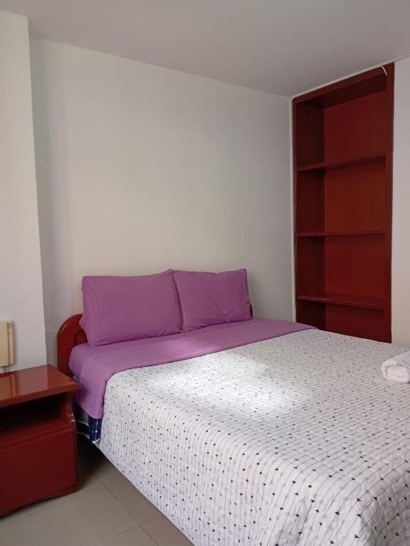 Postel nebo postele na pokoji v ubytování Hotel Manhattan City