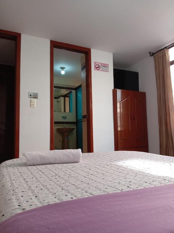Postel nebo postele na pokoji v ubytování Hotel Manhattan City