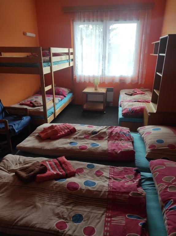 Postel nebo postele na pokoji v ubytování Hotel Na Trojce